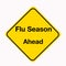 Diamond shaped yellow traffic warning sign with `Flu Season Ahead` as the subject.