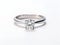 Diamond wedding ring on white background. White gold wedding ring with brilliant. Platinum diamond ring for wedding, engagement.
