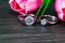 Diamond wedding rings with tulip flower on black background