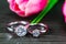 Diamond wedding rings with tulip flower on black background