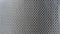 Diamond woven Black carbon fiber composite material background close up view