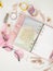 Diary opens with white and holographic page. Pink planner with cute stationery photographing in flatlay style. Top view of pink