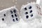 Dice dropped into the water, on a white background