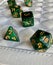 Dice game green polyhedral, MTG dice and cards.