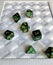 Dice game green polyhedral, MTG dice and cards.