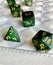 Dice game green polyhedral, MTG dice and cards.