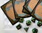 Dice game green polyhedral, MTG dice and cards.