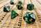 Dice game green polyhedral, MTG dice and cards.