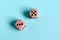 Dice with the numbers three and five on a light background.