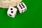 Dice white on green cloth or cloth