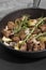 Diced Aberdeen Angus beef with shallots and rosemary, fried in a cast iron frying pan.