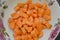 Diced carrots in a light plate