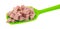 Diced ham on a green spoon