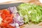 Diced vegetables and cheese on cutting board