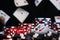 Dices and two ace cards surrounded by poker chips background of falling cards