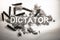 Dictator word written in ash, dirt, dust with bullets around as