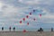 DIEPPE, FRANCE - SEPTEMBER 08, 2018: Red and white kites hearts are flying in the wind at the festival of kites in Atlantic ocean