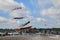 DIEPPE, FRANCE - SEPTEMBER 11, 2018: Kite festival. Octopus kites and flying caterpillar in the sky in Atlantic ocean