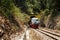 A diesel locomotive is leaving the  Pengalat Tunnel between Kota Kinabalu and Papar