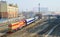 A diesel locomotive is pushing a passenger train in Dalian,China