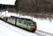 Diesel locomotive with wagons locomotive rides by rail in winter