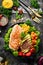 Diet bowl: Chicken fillet, avocado, pumpkin, cherry tomatoes, flax and corn in a black bowl. Bowl Buddha. Top view.