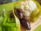 Diet concept, healthy eating, lettuce, cauliflower, eggplant, measuring tape vegetables