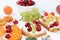 Diet fruit sandwiches with cottage cheese, peaches, grapes and cherries, a healthy breakfast with ingredients. The concept of