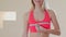 Diet, health and exercising concept - beautiful sporty woman measuring her breast