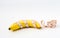 Diet healthy concept. Banana with measuring tape on white background
