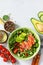 Diet menu concept. Summer Healthy salad with quinoa, Tomatoes, Salmon, Avocado and arugula.