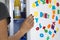 Diet message from colourful letters on white fridge with hungry woman looking inside