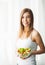 Diet. Portrait of a happy playful girl eating fresh salad