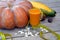 Diet pumpkin. A huge pumpkin with vegetables lies next to a glass of natural pumpkin juice and a centimeter-long ribbon
