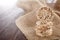 Diet rice cakes pile on the wooden table covered with homespun napkin, selective focus, backlight.