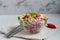 Diet salad made from fresh vegetables. Peking cabbage lilac and green, tomatoes, green onions and chili peppers. Dressed with