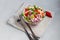 Diet salad made from fresh vegetables. Peking cabbage lilac and green, tomatoes, green onions and chili peppers. Dressed with