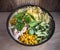 Diet salad of Peking cabbage and boiled chicken. Canned corn and fresh cucumbers and fresh greens. Close-up. Salad dressing.