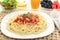 Diet spaghetti bolognese with white meat and fruit