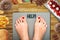 Diet temptation or hard to lose weight concept with woman weighing on bathroom scale with many sweets and fast food around