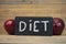 `diet` word on blackboard with arrow show on red apple