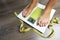 Diet word on weight scale screen with woman feet and measurement tape