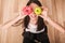 Diet. A young woman holding a pizza on the scales and make a choice between an apple and a donut. The concept of healthy eating