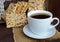 Dietary crunchy cracker with cereals (sunflower seeds, flax and sesame) and a cup of tea