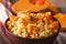 Dietary food: rice with pumpkin macro on the table. Horizontal