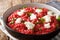 Dietary Orzotto perlotto from pearl barley with beets and goat cheese close-up on the table. horizontal