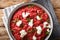 Dietary Orzotto perlotto from pearl barley with beets and goat cheese close-up on the table. Horizontal top view