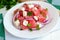 Dietary salad from fresh watermelon, blue onion and goat cheese