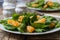 Dietary spinach salad and Mandarin oranges with lemon dressing and sesame seeds