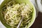 Dietary zucchini pasta in a bowl closeup. horizontal top view